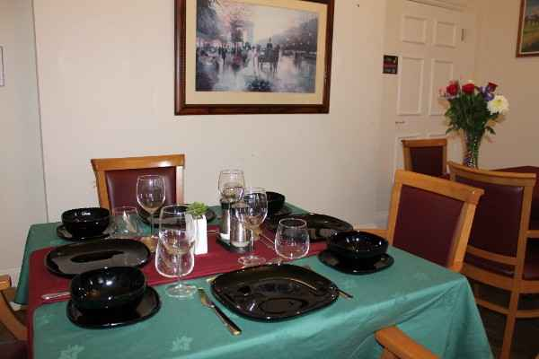 Beautifully set dining tables with fresh food